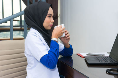 Young woman using mobile phone