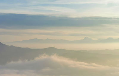 Low angle view of mountains against sky during sunset