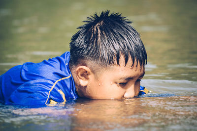 Portrait of boy in swimming pool