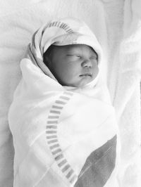 Cute baby sleeping in bed