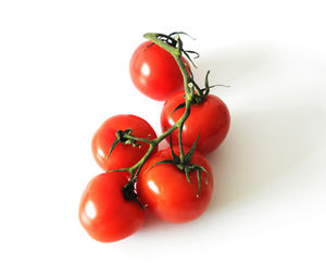 Close-up of cherry tomatoes against white background