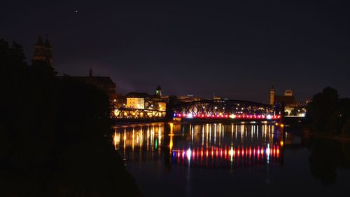 Reflection of illuminated buildings in water