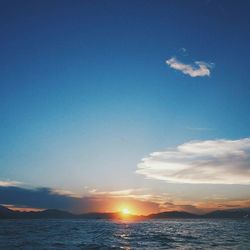 Scenic view of sea against sky at sunset
