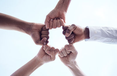 Cropped image of couple holding hands