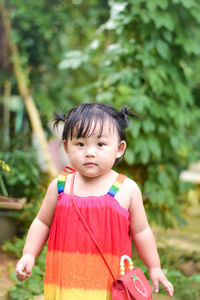 Portrait of cute girl standing outdoors