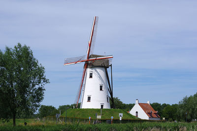 Traditional windmill against sky