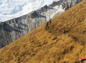 People walking on snow covered land