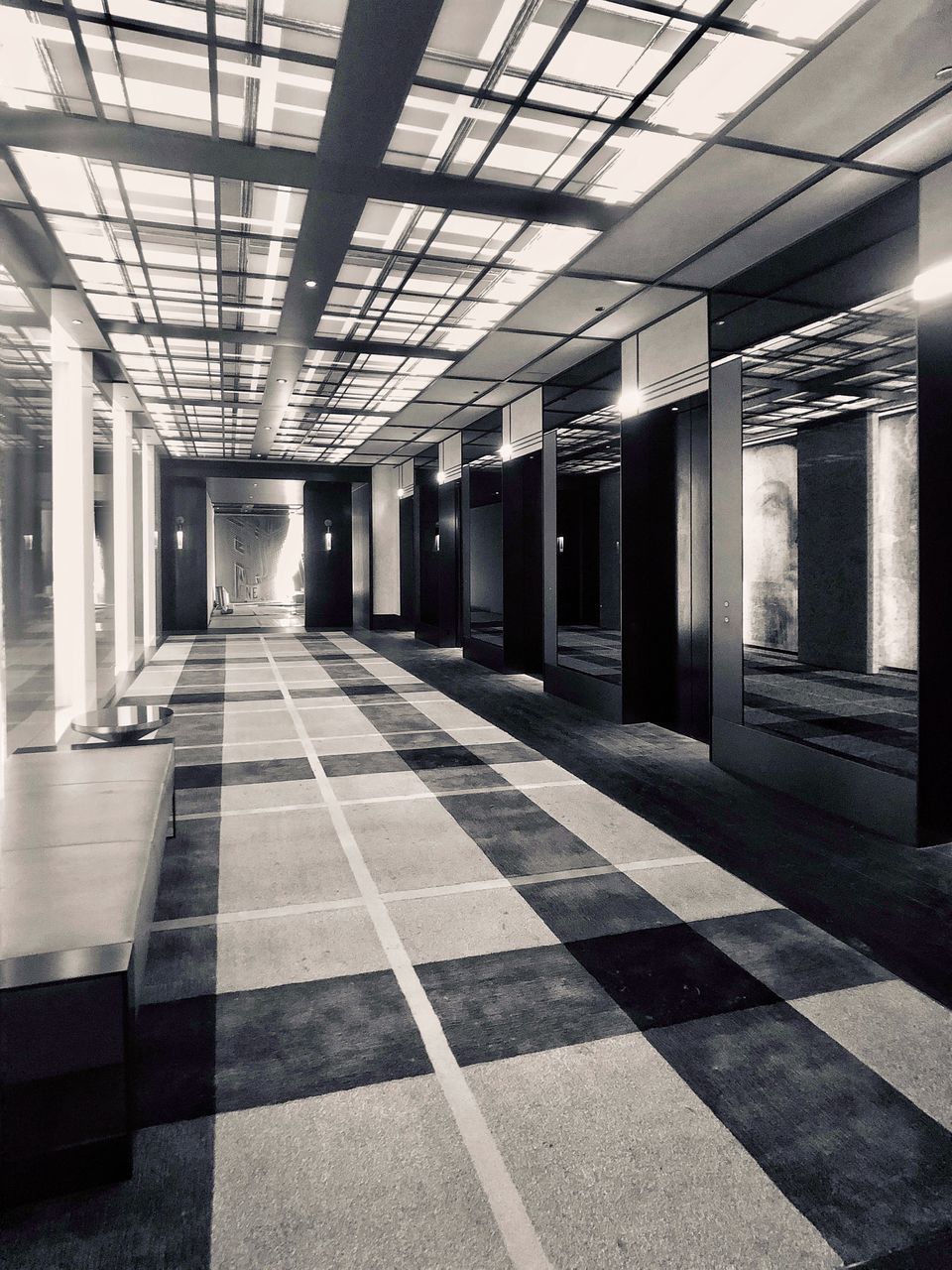 architecture, indoors, built structure, no people, flooring, ceiling, architectural column, empty, building, absence, tiled floor, entrance, tile, checked pattern, door, lighting equipment, day, illuminated, arcade