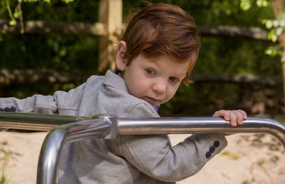 Boy holding outdoors