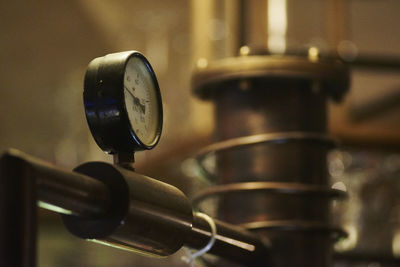 Close-up of gauge on distiller