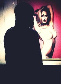 Woman standing on wall