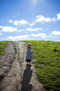 Young stylish girl looking back on pathway in detroit mi