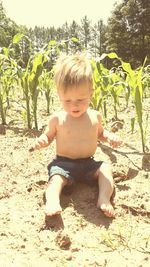 Full length of baby boy against trees