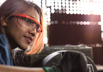 Close-up portrait of young woman with eyeglasses