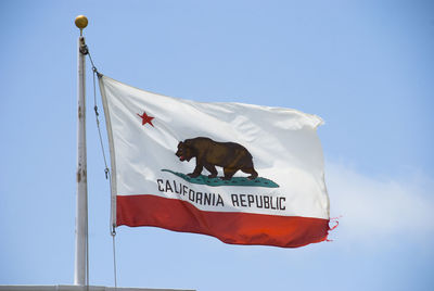 Low angle view of california flag against clear sky