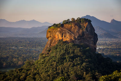 Scenic view of mountains against sky at sunset