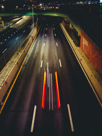 High angle view of traffic lights on road at night