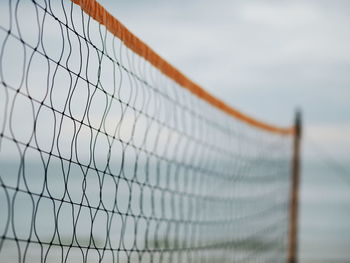 Close-up of basketball hoop against sky