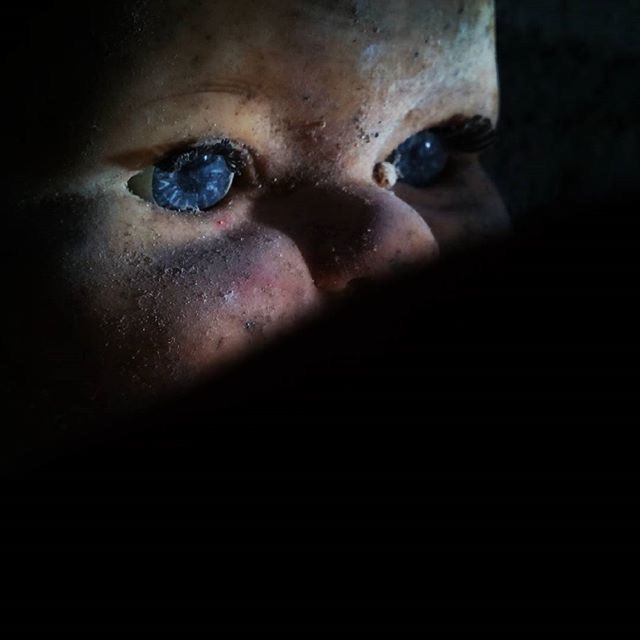 indoors, close-up, black background, studio shot, human face, part of, human eye, portrait, looking at camera, front view, headshot, human skin, dark, lifestyles, copy space, person, spooky