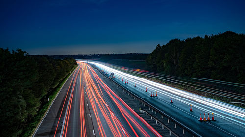 High angle view of light trails on road