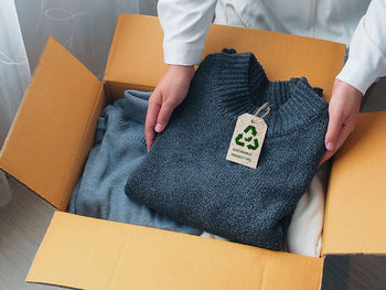 Midsection of woman holding gift box