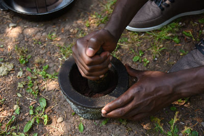 Low section of man working in mud