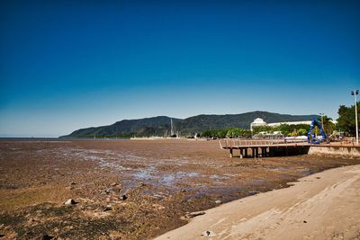 Scenic view of land against clear blue sky