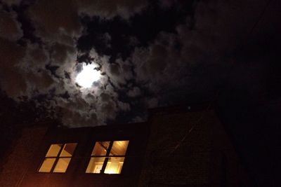 Low angle view of building against cloudy sky