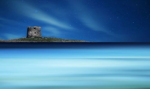 Scenic view of sea against sky at night