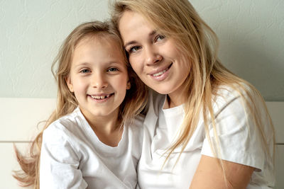 Portrait of happy mother and daughter