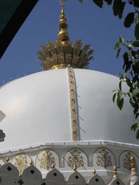 Low angle view of ornate building against sky