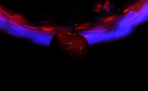 Close-up of apple against black background