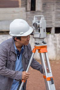 Close-up of surveyor working outdoors