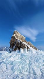 Scenic view of snow covered mountain against sky