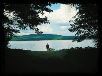 Scenic view of lake against cloudy sky