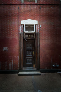 Brick wall with closed door