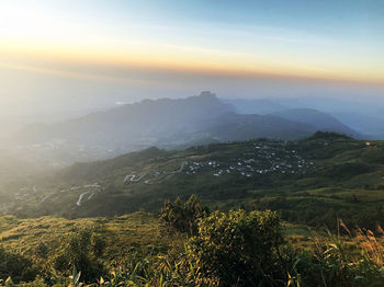 Scenic view of mountains against sky during sunset