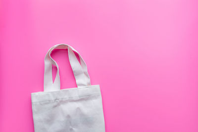 Close-up of pink paper against white background