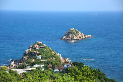 High angle view of building by sea against sky