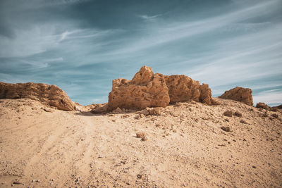 Rock formations in desert against sky