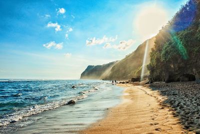 Panoramic view of beach against cloudy sky