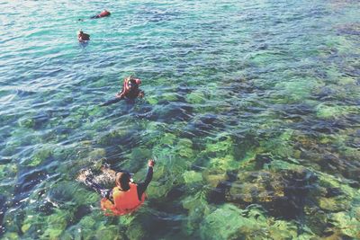 People swimming in sea