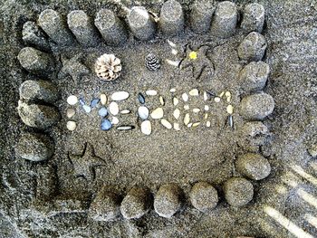 Close-up of pebbles on sand