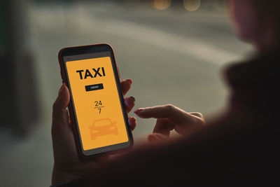 Ordering taxi online using mobile app on smart phone. booking taxi using application online. mobile