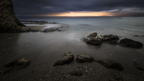 Scenic view of sea against sky during sunset
