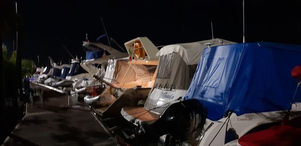 Panoramic view of objects in row at night