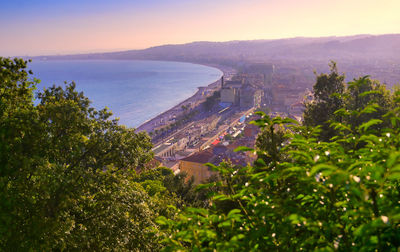 High angle view of buildings and sea against sky