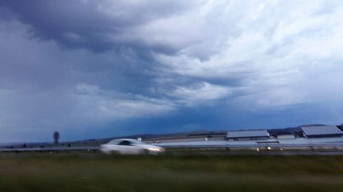 Cloudy sky over road