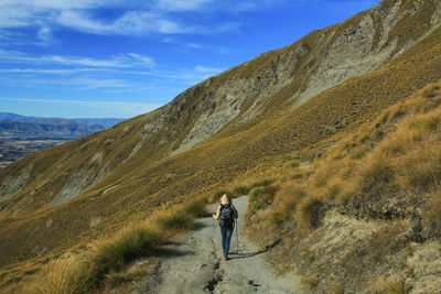 Full length of man on mountain against sky