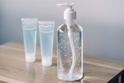 Close-up of glass bottle with water on table